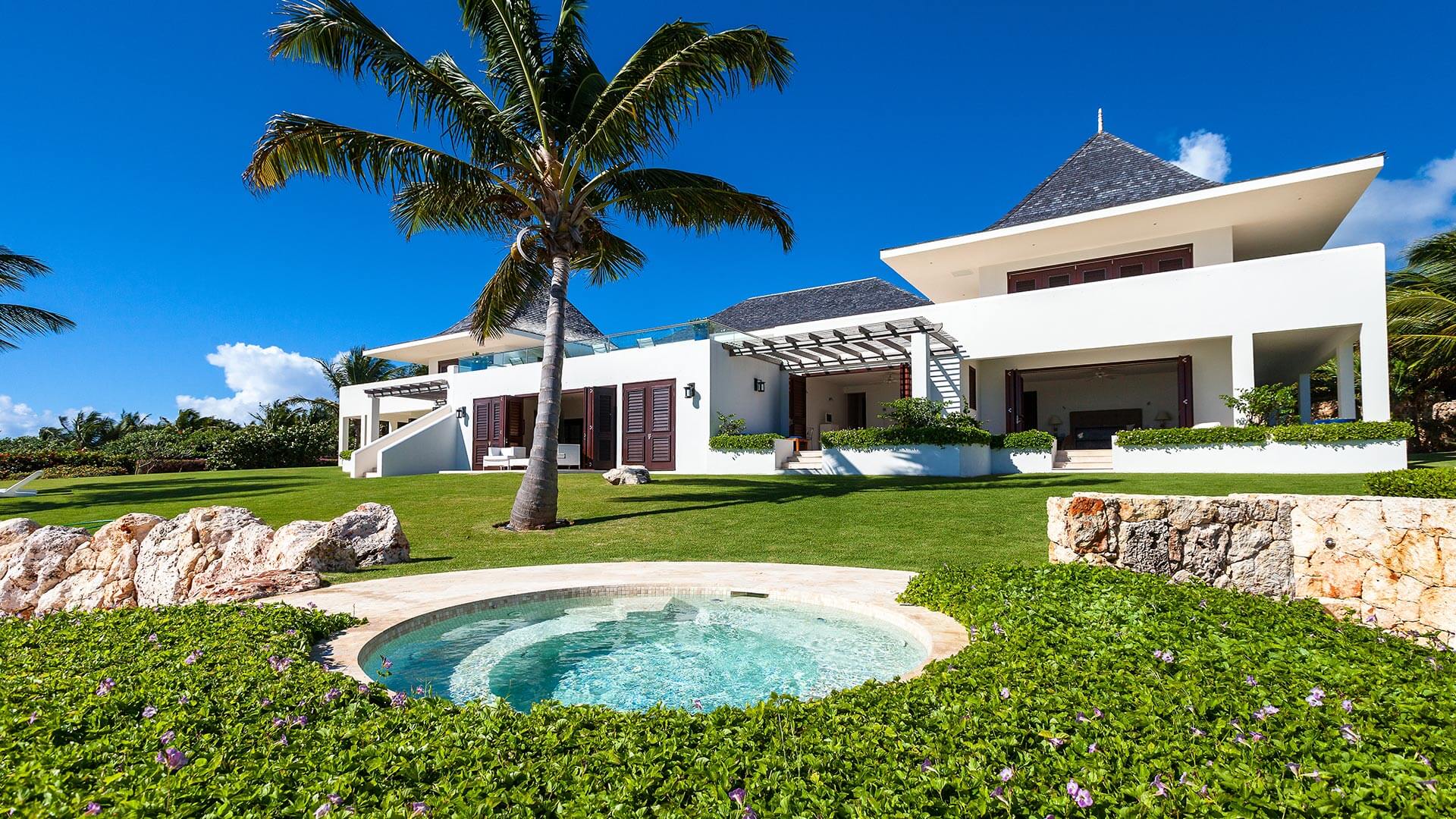 A hot tub is the perfect addition to the two private pools on the Le Bleu Villa rental property.
