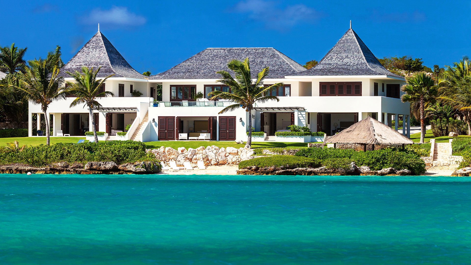 Le Bleu Villa on Anguilla features ten master suites and sits upon a stunning tropical landscape making it a premiere rental villa on the island.
